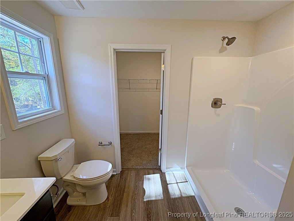 18 Morgan Court Spring Lake, NC 28390 - Photo 11 of 16 a bathroom with a toilet and a shower