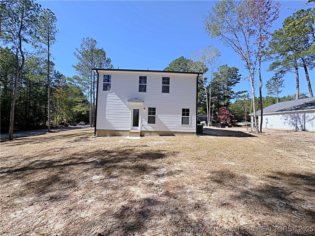 18 Morgan Court Spring Lake, NC 28390 - Photo 15 of 16 a view of a house with a yard covered in snow