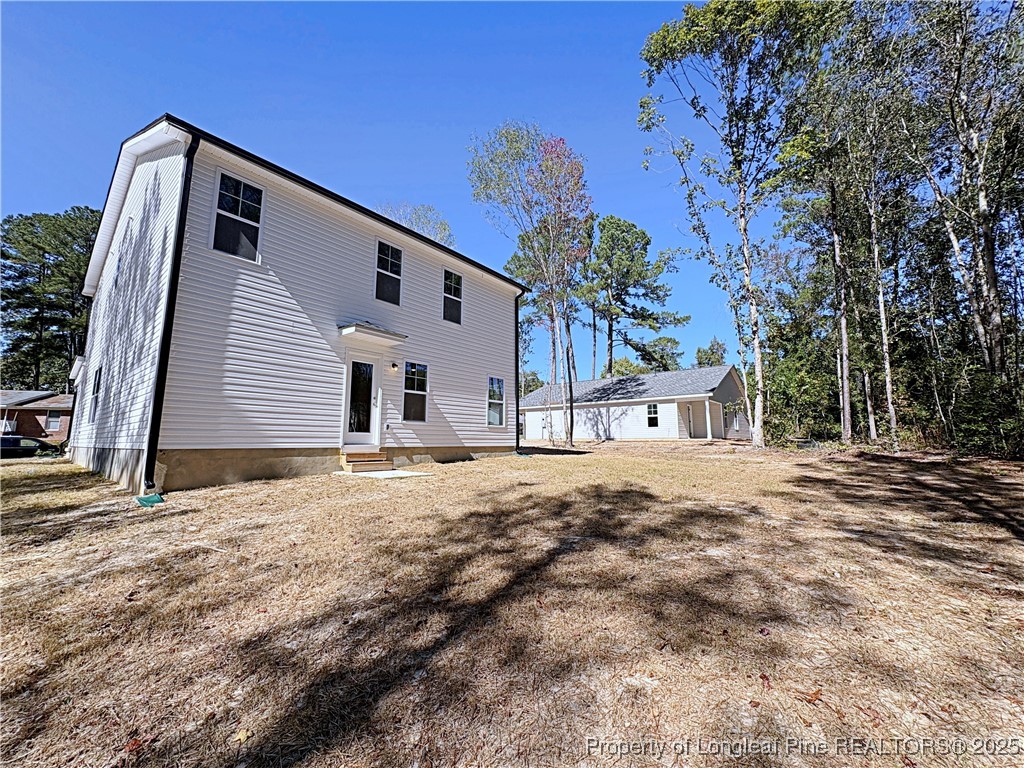 18 Morgan Court Spring Lake, NC 28390 - Photo 16 of 16 a front view of a house with a yard and garage