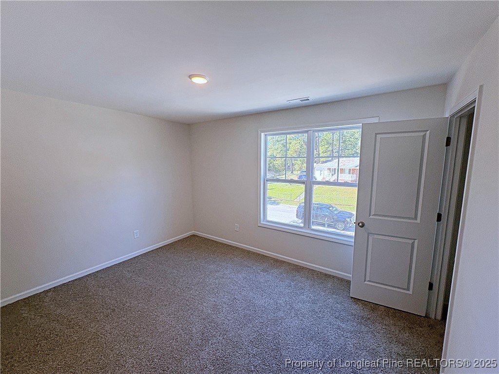 18 Morgan Court Spring Lake, NC 28390 - Photo 8 of 16 an empty room with a window