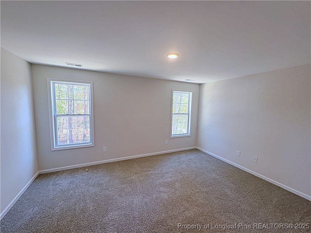 18 Morgan Court Spring Lake, NC 28390 - Photo 9 of 16 an empty room with windows
