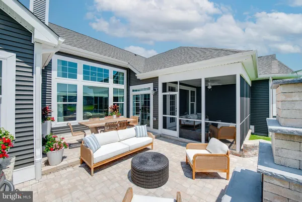 a balcony with furniture and a garden
