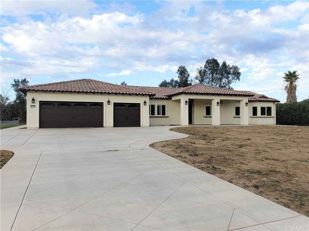 28350 Moreland Road Menifee, CA 92585 - Photo 1 of 1 a front view of a house with a garage