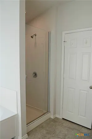 an empty room with a empty space and windows