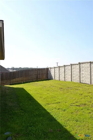 a house view with garden space and trees