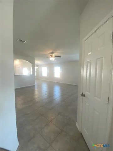 a view of an empty room with a window