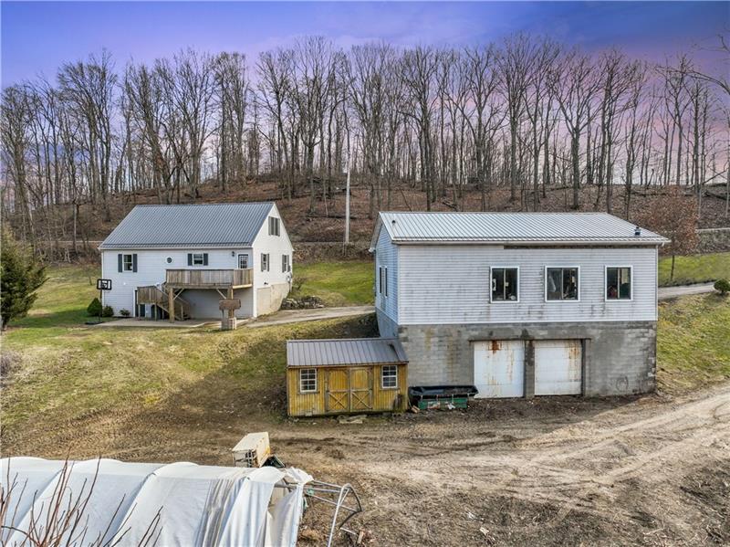 163 Upper Service Road Hookstown, PA 15050 - Photo 38 of 41 a aerial view of a house with a yard and roof