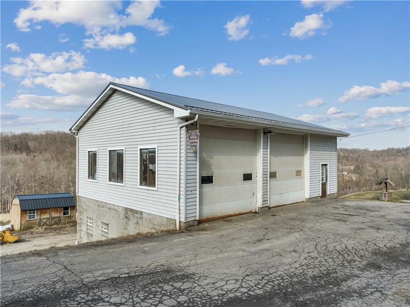 163 Upper Service Road Hookstown, PA 15050 - Photo 41 of 41 a view of a house with a backyard