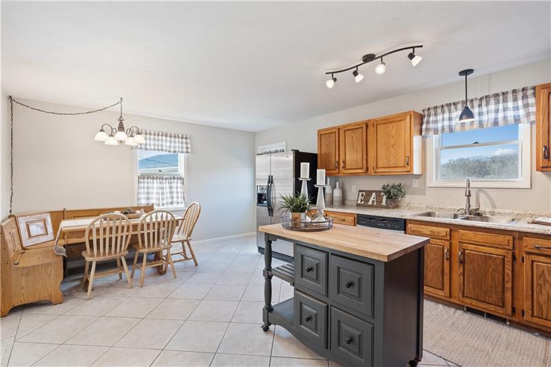 163 Upper Service Road Hookstown, PA 15050 - Photo 8 of 41 a view of a kitchen area with furniture and window