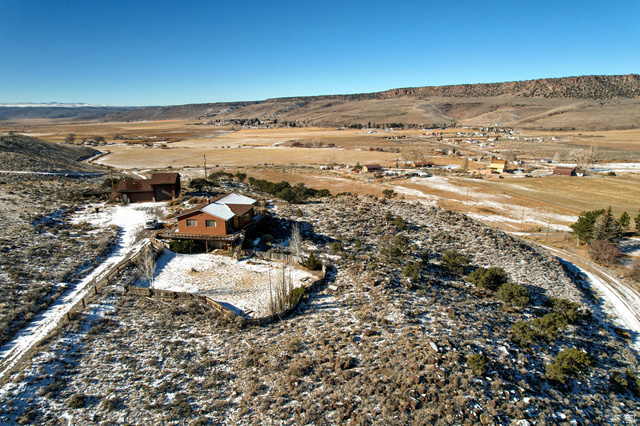 1208 East Tidwell Road Loa, UT 84747 - Photo 6 of 40 Aerial view of property and surrounding area with rural landscape