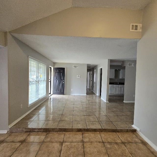 3693 Windermere Road Memphis, TN 38128 - Photo 7 of 10 a view of an empty room with kitchen and window