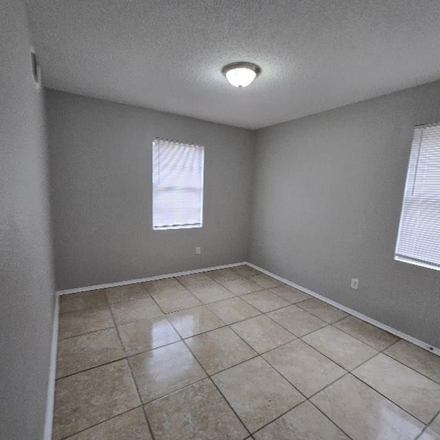 3693 Windermere Road Memphis, TN 38128 - Photo 9 of 10 an empty room with windows