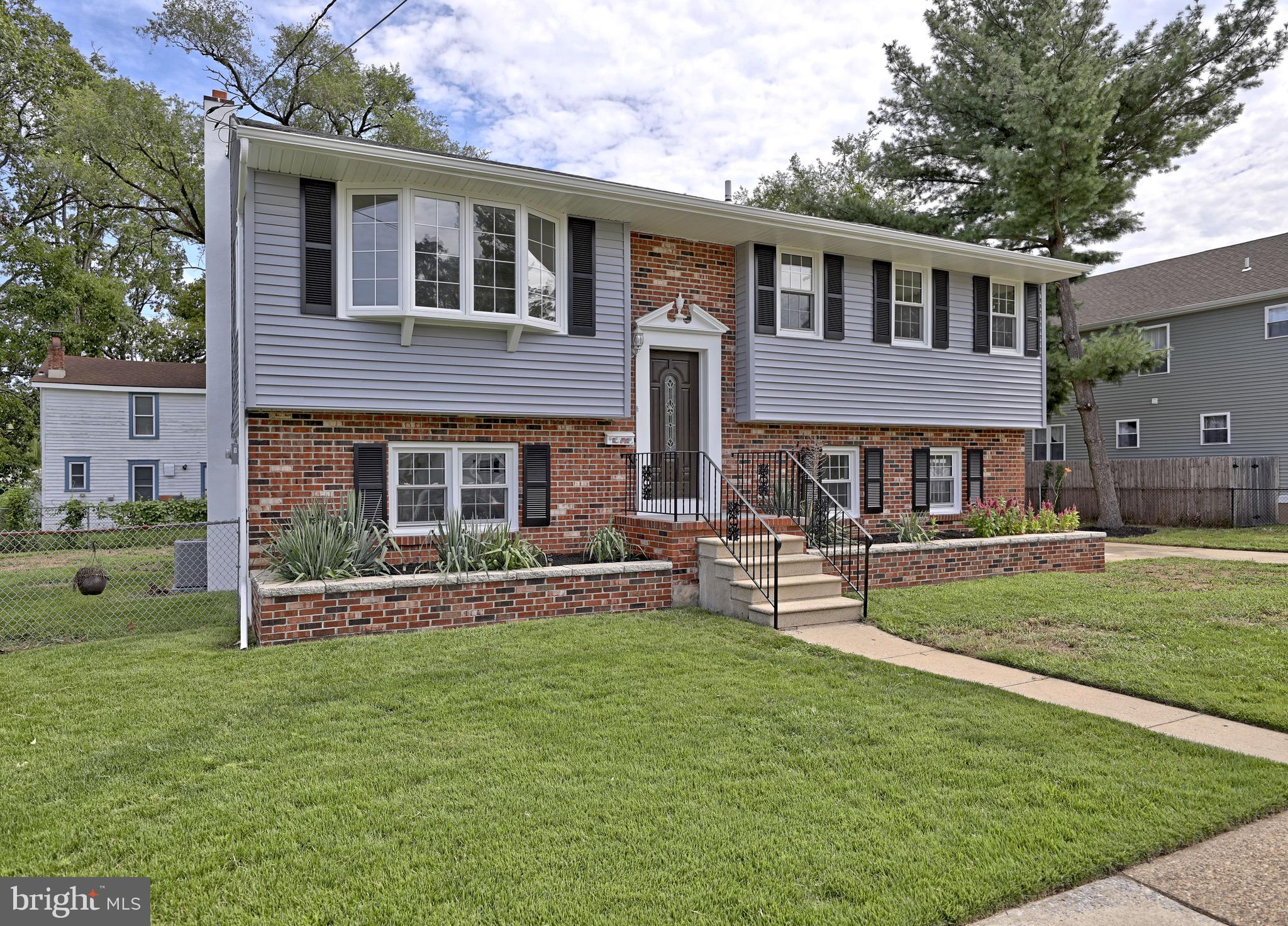 620 Arndt Avenue Riverside, NJ 08075 - Photo 2 of 22 a front view of a house with a yard table and chairs