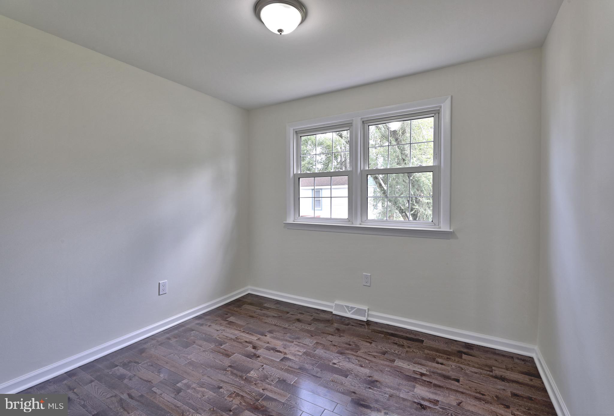 620 Arndt Avenue Riverside, NJ 08075 - Photo 14 of 22 wooden floor in an empty room with a window