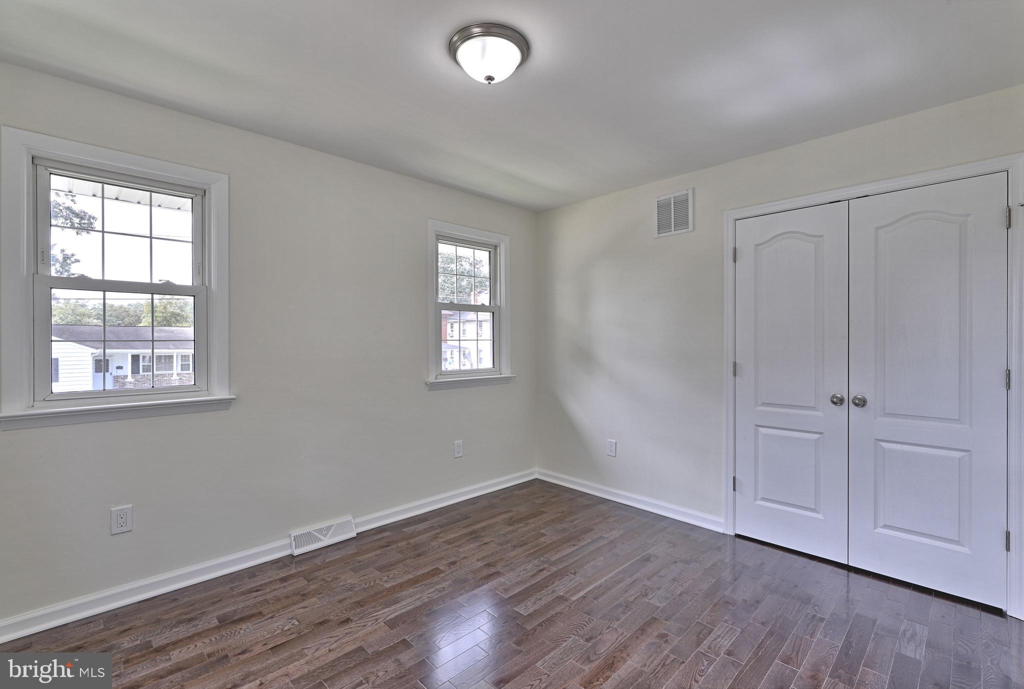 620 Arndt Avenue Riverside, NJ 08075 - Photo 15 of 22 a view of an empty room with wooden floor and a window