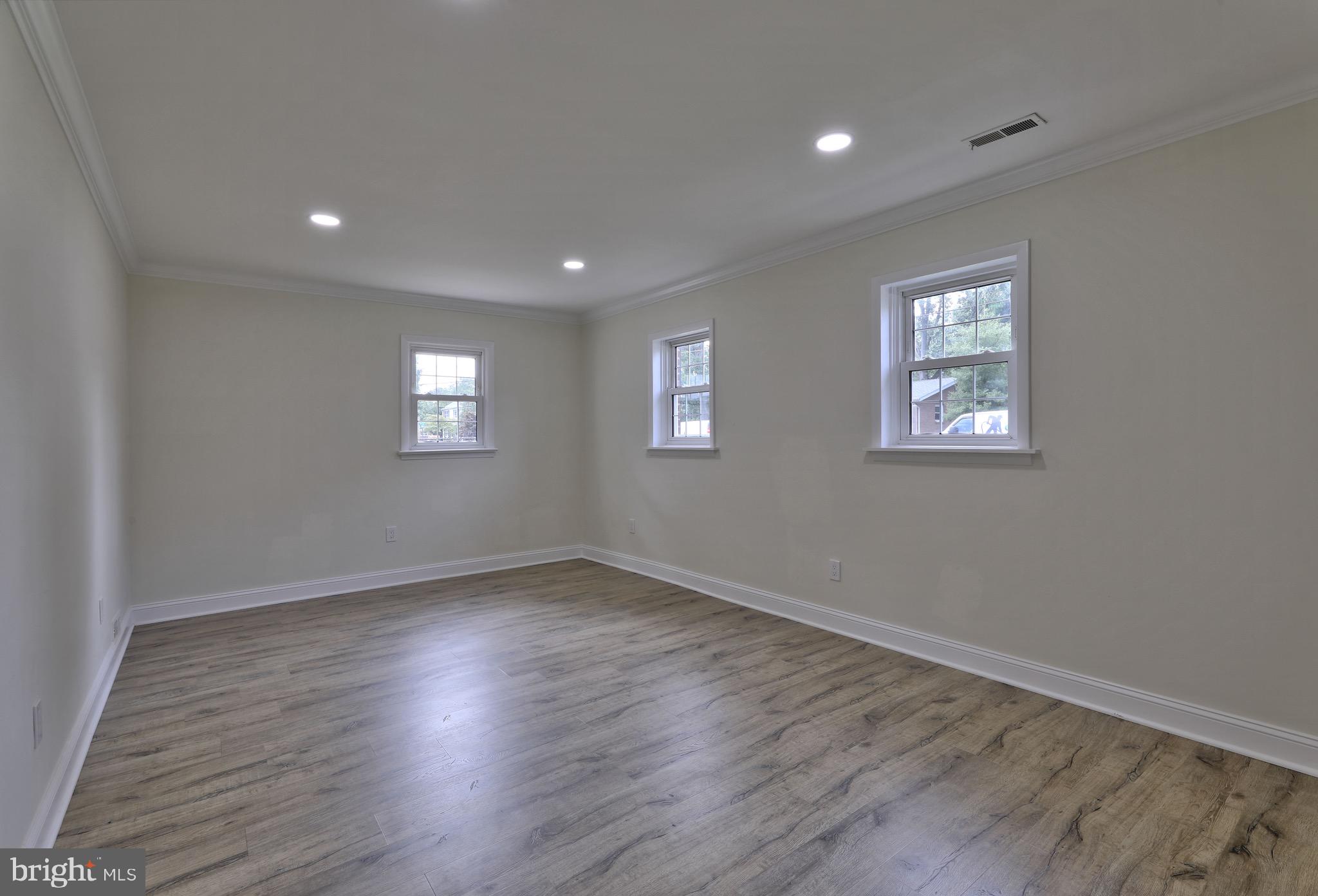 620 Arndt Avenue Riverside, NJ 08075 - Photo 18 of 22 a view of an empty room with wooden floor and a window