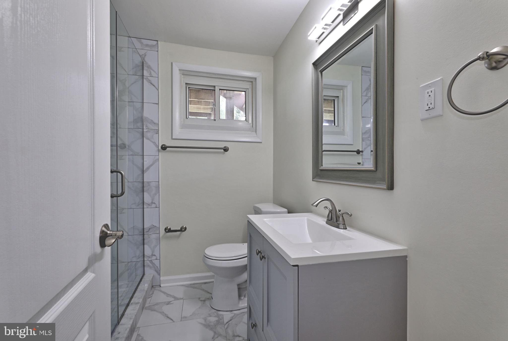 620 Arndt Avenue Riverside, NJ 08075 - Photo 20 of 22 a bathroom with a sink mirror vanity and toilet