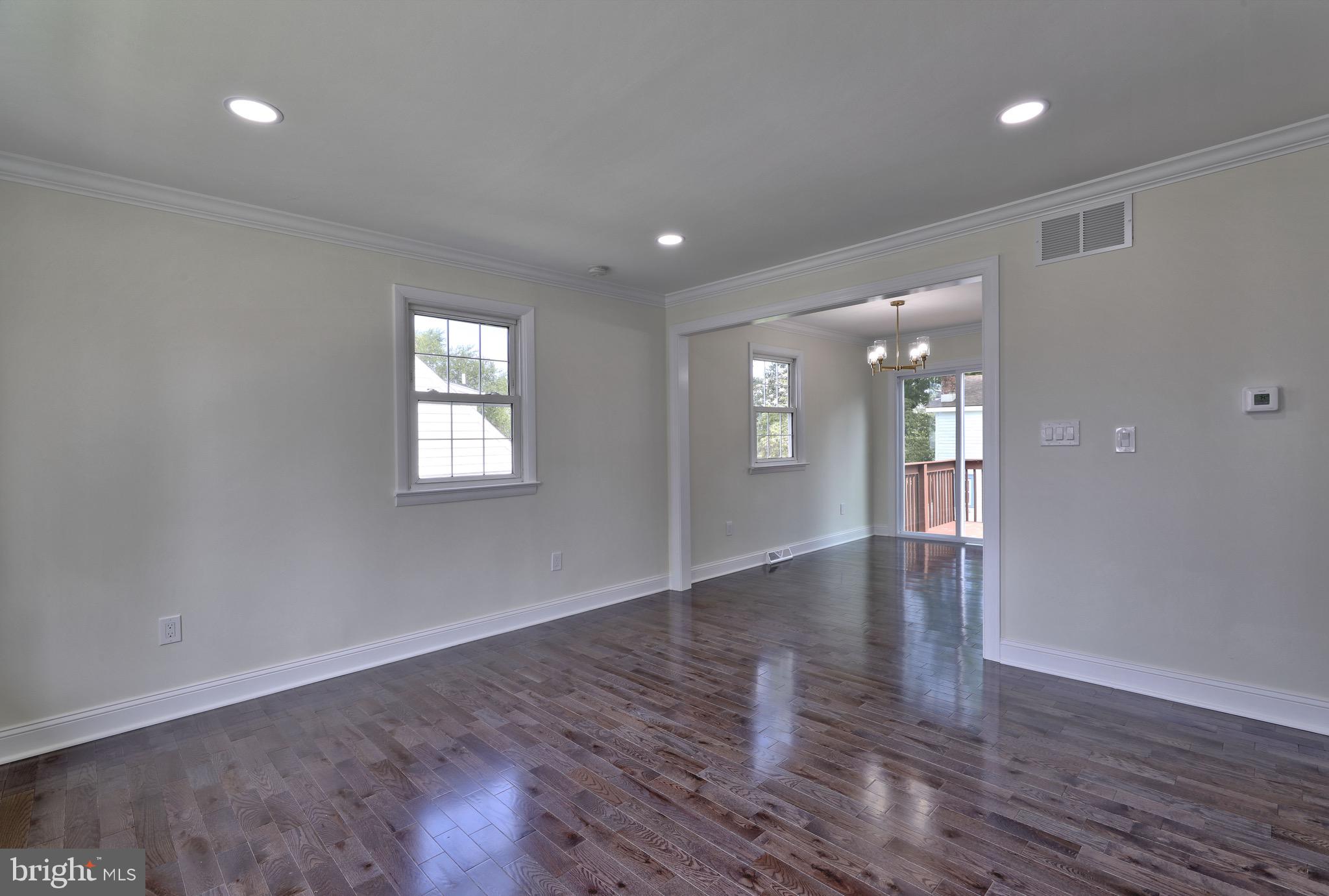 620 Arndt Avenue Riverside, NJ 08075 - Photo 6 of 22 a view of an empty room with wooden floor and a window