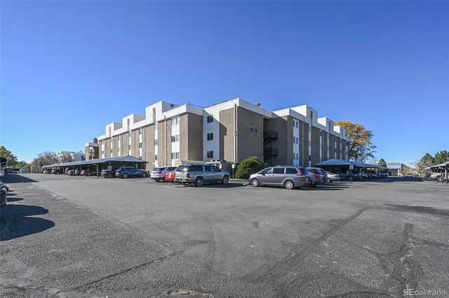 a view of a city street with tall buildings