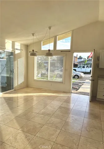 a view of a kitchen with kitchen area and windows