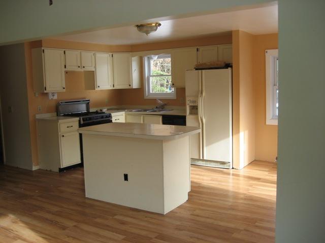 513 Polikoff Road Sheffield, MA 01222 - Photo 2 of 9 a kitchen with kitchen island a counter top space a sink a refrigerator and a stove