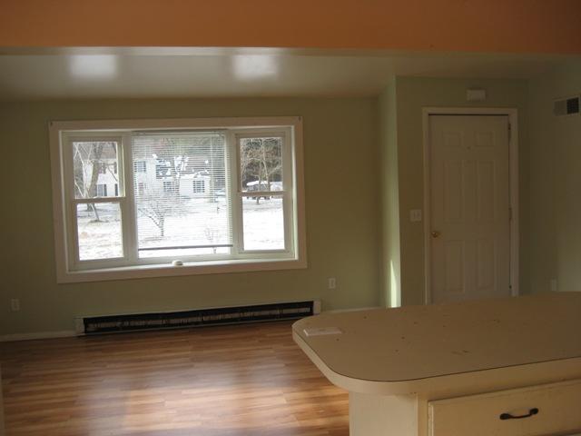 513 Polikoff Road Sheffield, MA 01222 - Photo 4 of 9 a view of empty room with wooden floor and fan