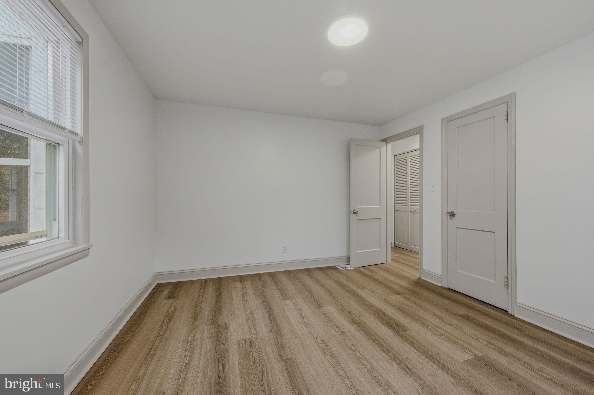 208 Harding Avenue Wilmington, DE 19804 - Photo 11 of 28 a view of room with window and hardwood floor