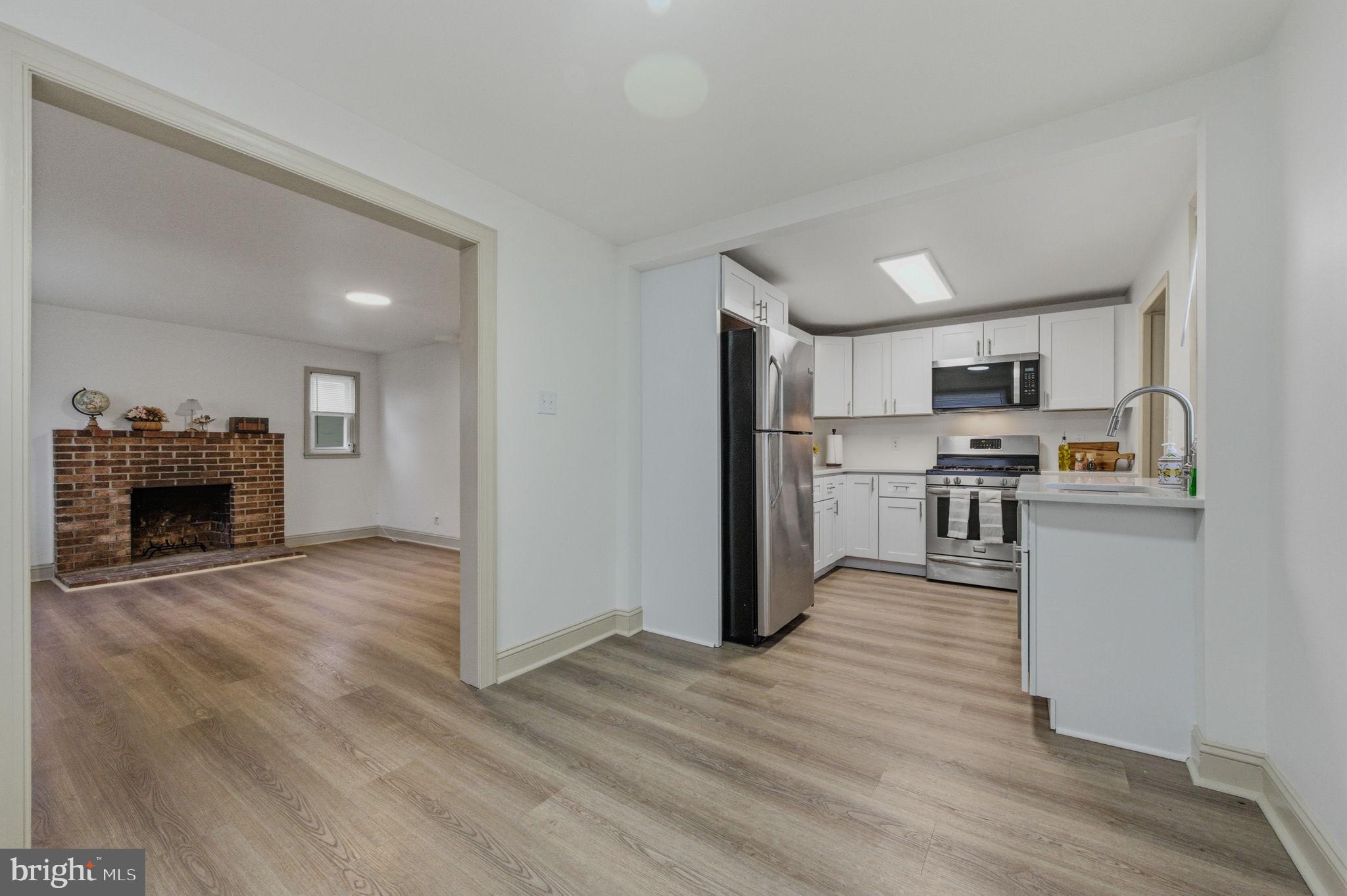 208 Harding Avenue Wilmington, DE 19804 - Photo 15 of 28 a view of kitchen with granite countertop cabinets and refrigerator