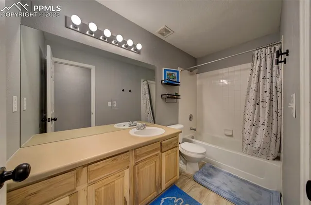 a bedroom with bed and a window