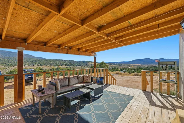 a view of a chairs in wooden deck