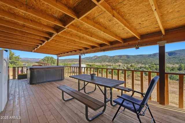 a view of a chairs and table in the balcony