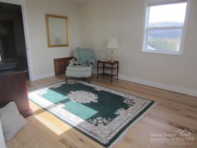 8188 Southwest Ridge Lane Powell Butte, OR 97753 - Photo 20 of 25 a living room with rug and a rug