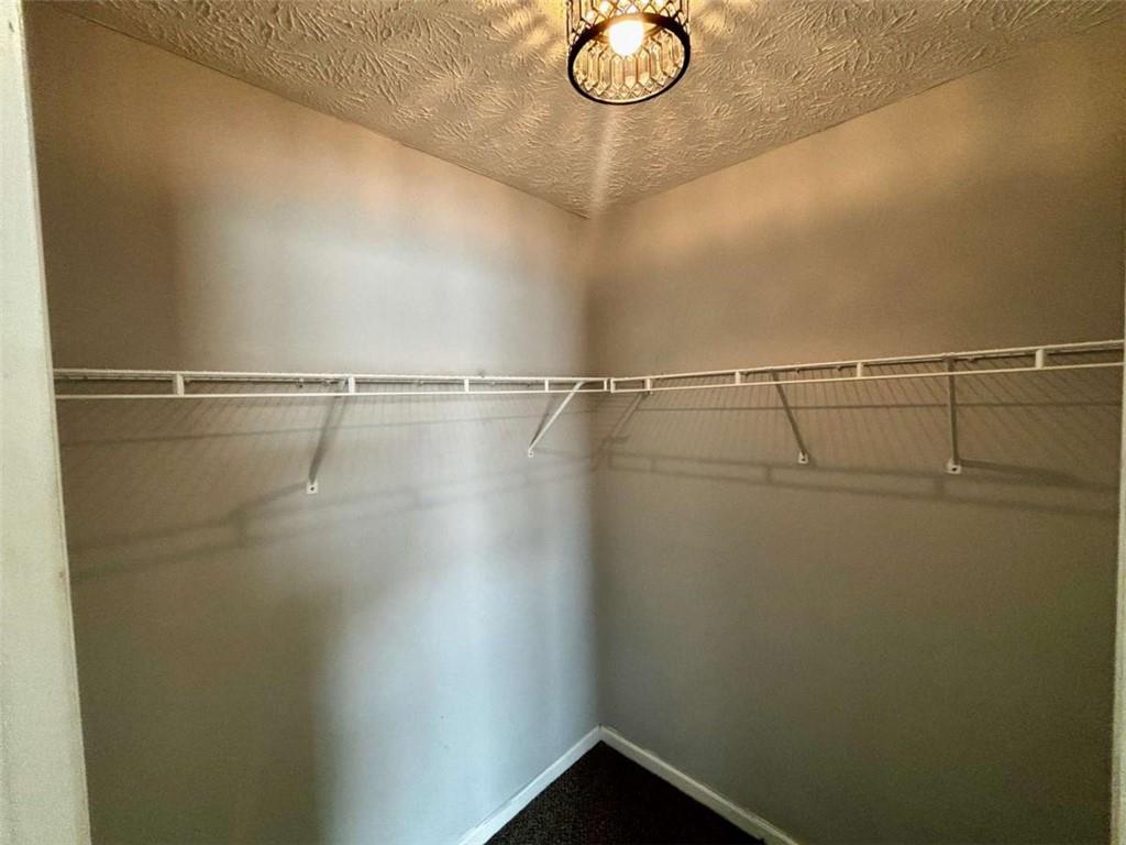 4249 High Park Lane East Point, GA 30344 - Photo 16 of 27 a view of a room with racks on the wall