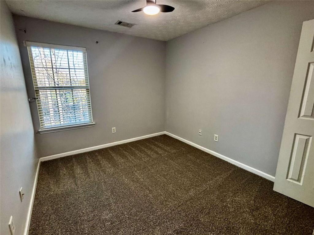 4249 High Park Lane East Point, GA 30344 - Photo 18 of 27 an empty room with windows