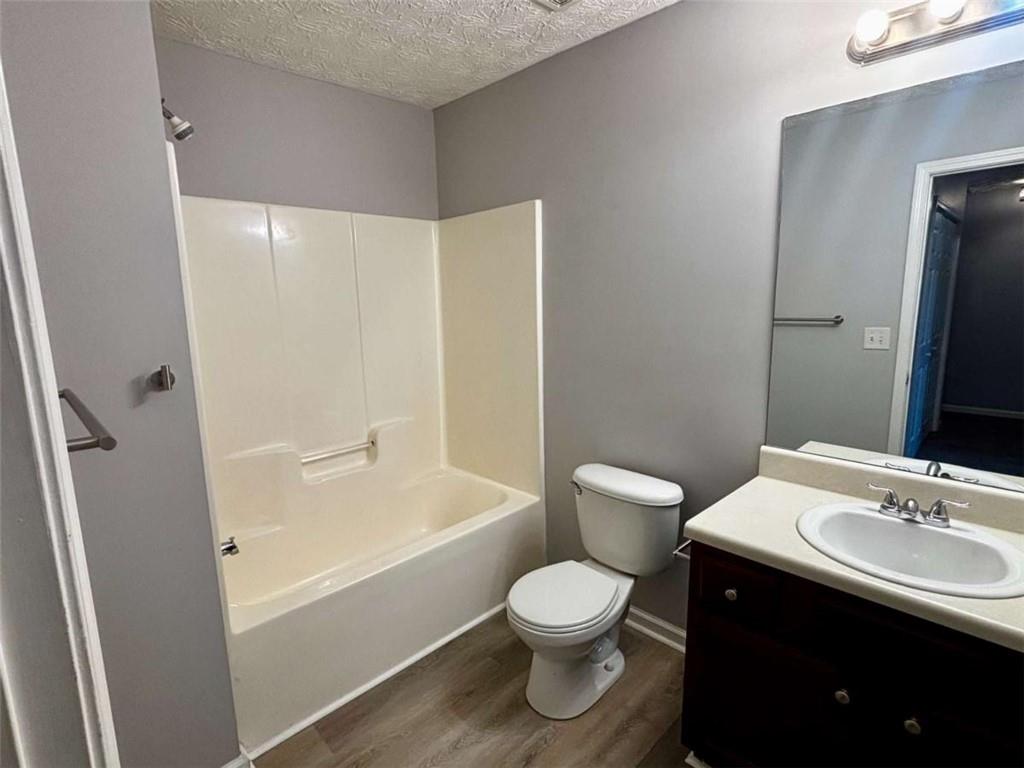 4249 High Park Lane East Point, GA 30344 - Photo 24 of 27 a bathroom with a sink a toilet and shower