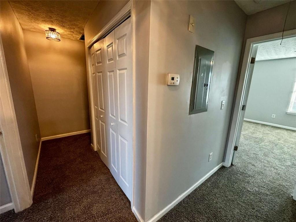 4249 High Park Lane East Point, GA 30344 - Photo 26 of 27 a view of a hallway with wooden floor and staircase