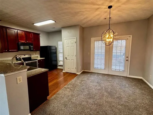 a kitchen that has a cabinets stainless steel appliances and a window