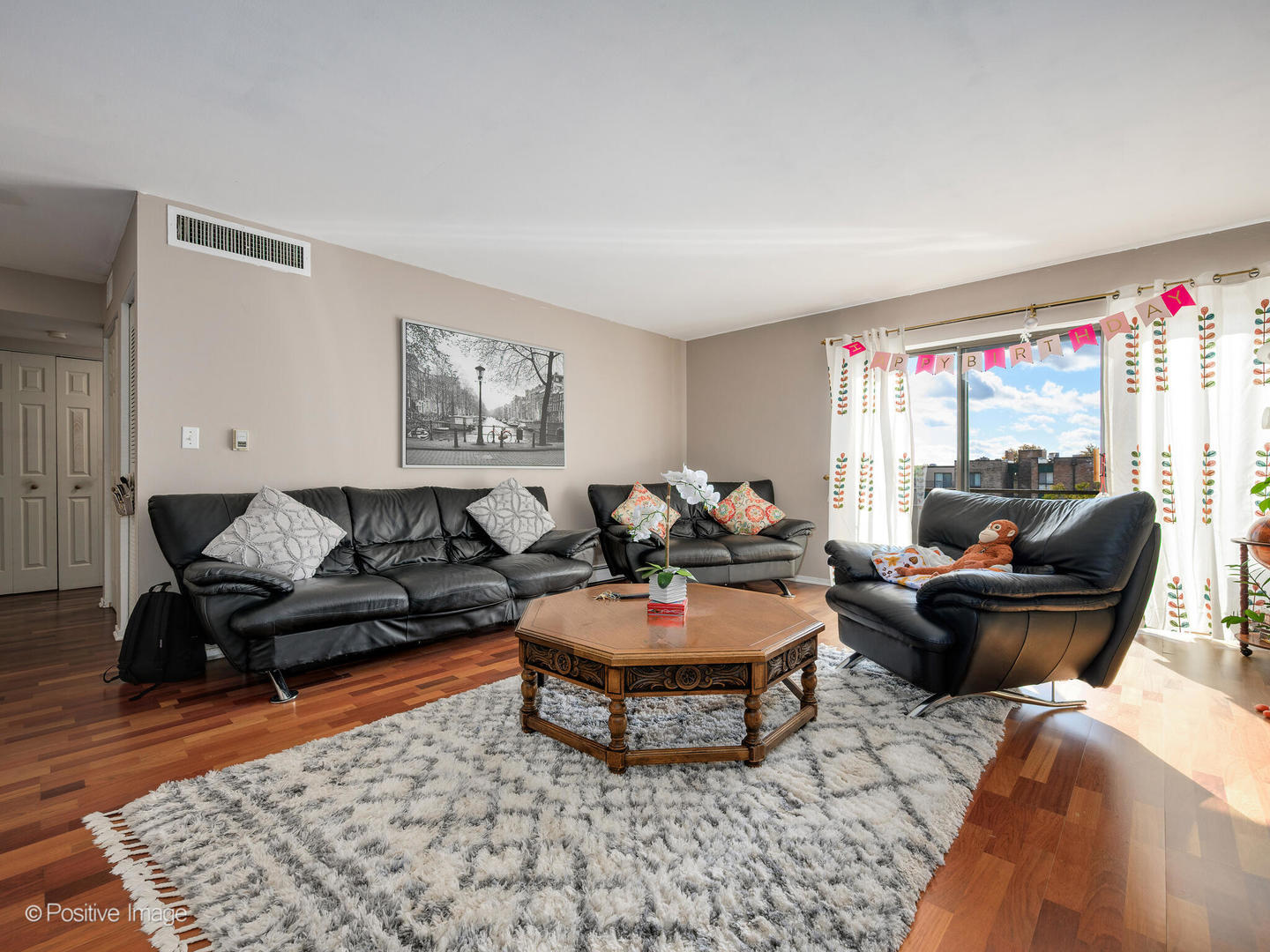 1931 Prairie Square, Unit 311 Schaumburg, IL 60173 - Photo 4 of 20 a living room with furniture a rug and a window