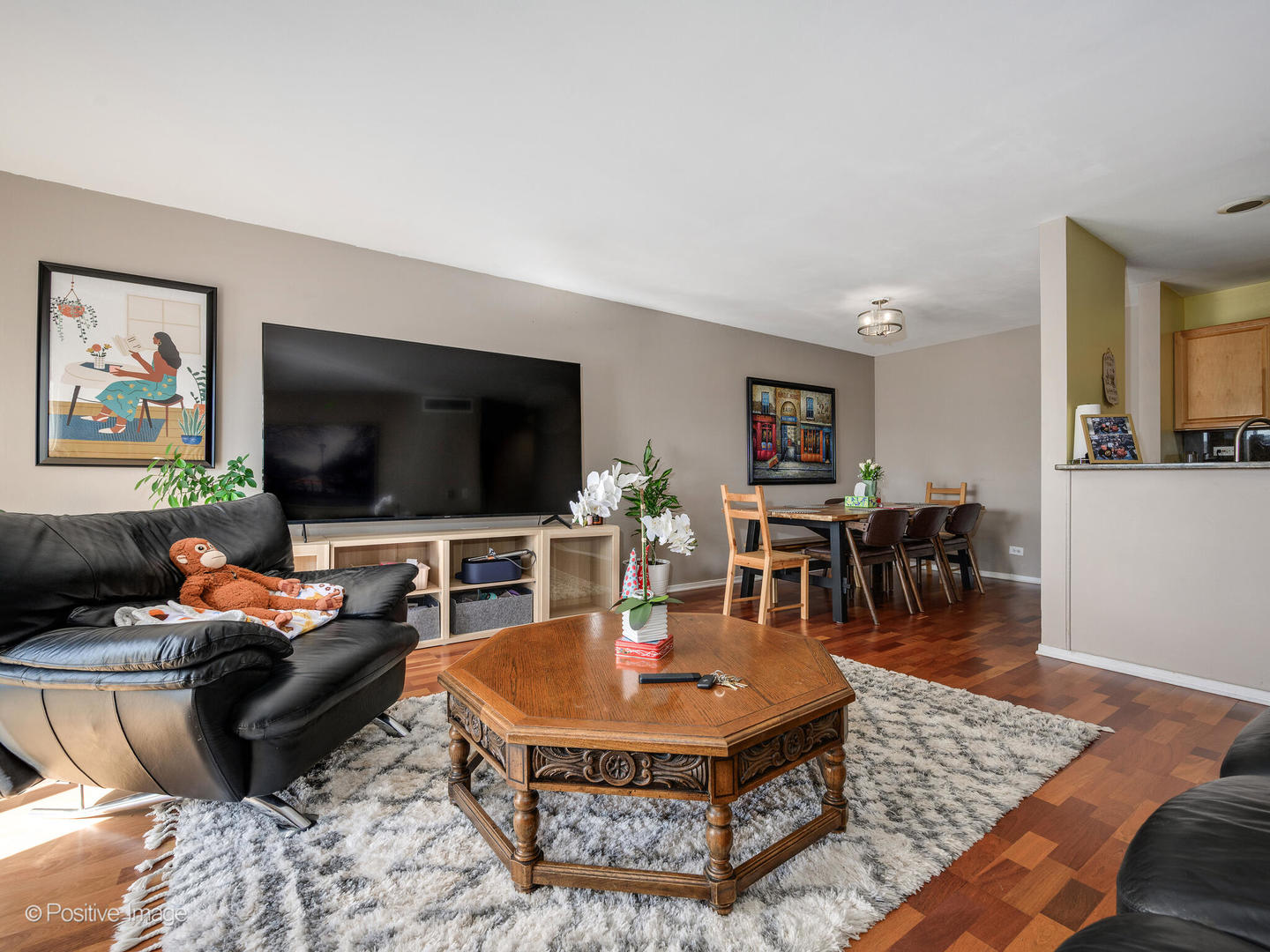 1931 Prairie Square, Unit 311 Schaumburg, IL 60173 - Photo 5 of 20 a living room with furniture and a flat screen tv