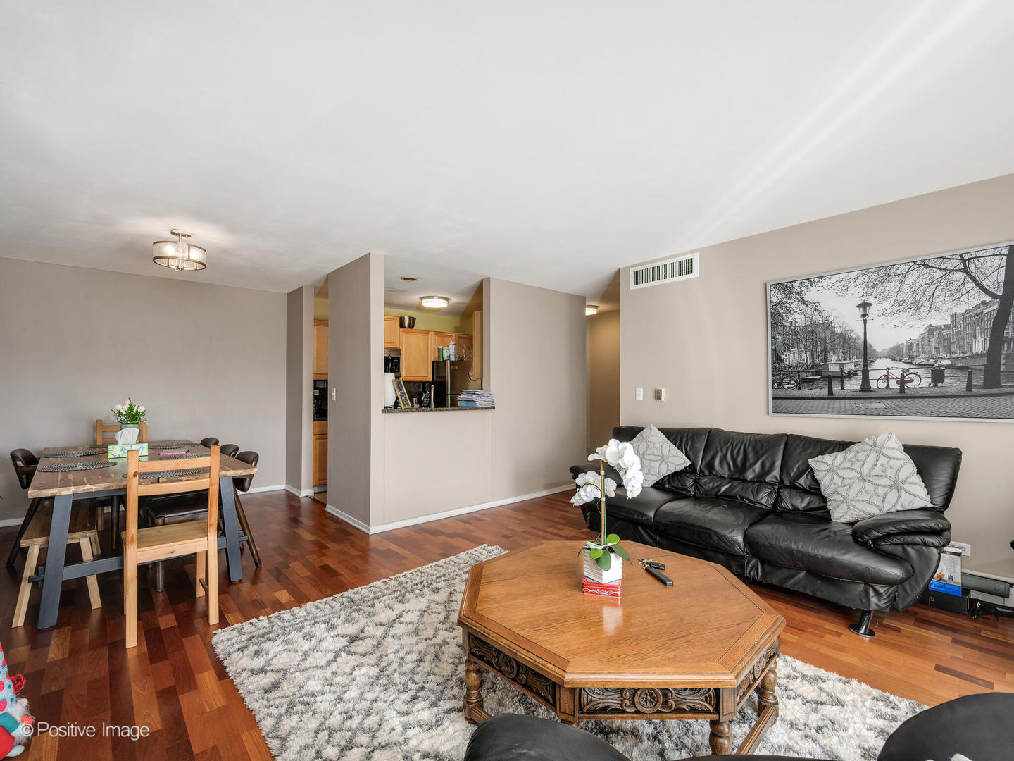 1931 Prairie Square, Unit 311 Schaumburg, IL 60173 - Photo 6 of 20 a living room with furniture and wooden floor