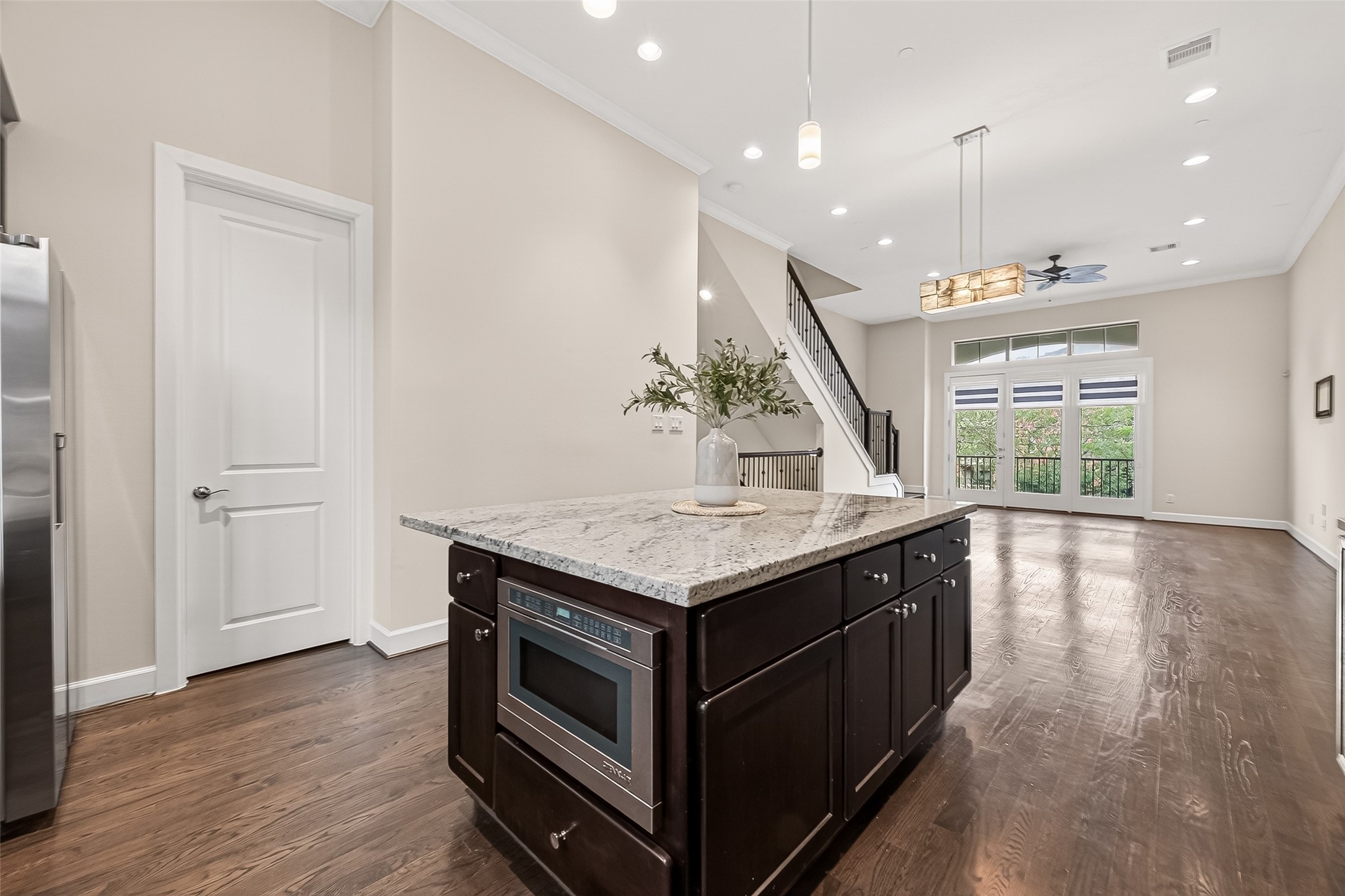 5305 Weslayan Street Houston, TX 77005 - Photo 17 of 50 a kitchen with a stove and a wooden floor