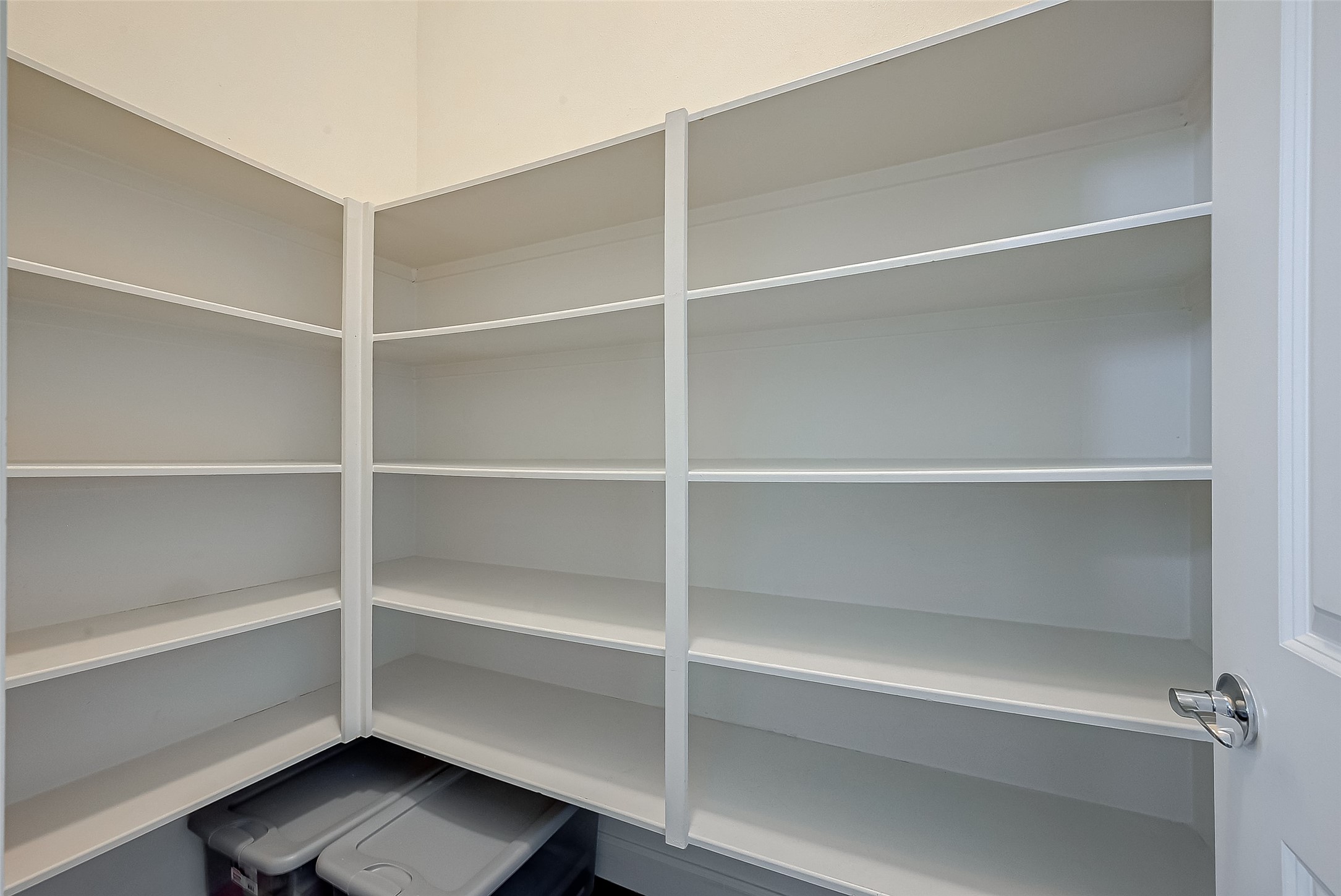 5305 Weslayan Street Houston, TX 77005 - Photo 18 of 50 a view of walk in closet with empty racks