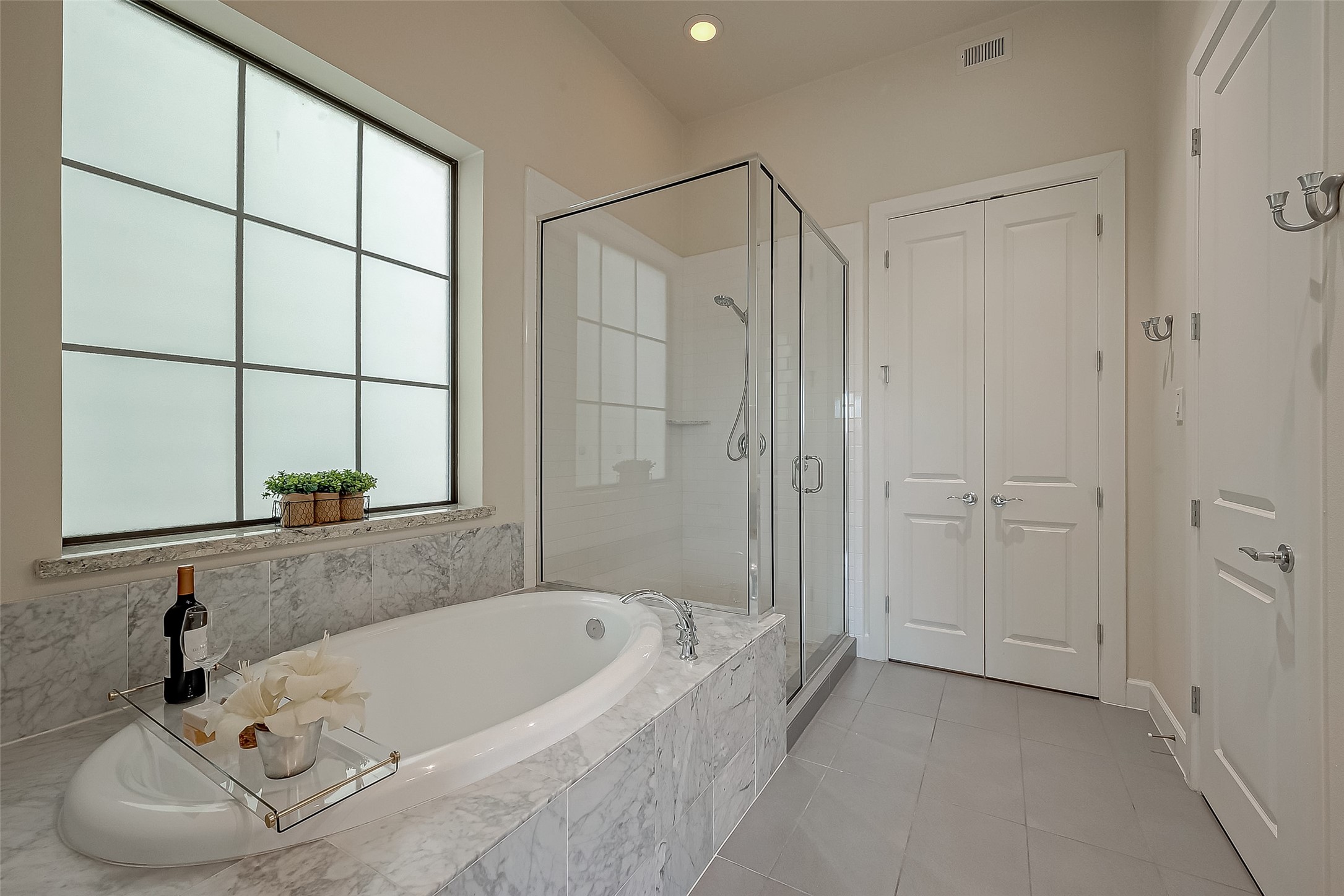 5305 Weslayan Street Houston, TX 77005 - Photo 26 of 50 a bathroom with a tub and a sink
