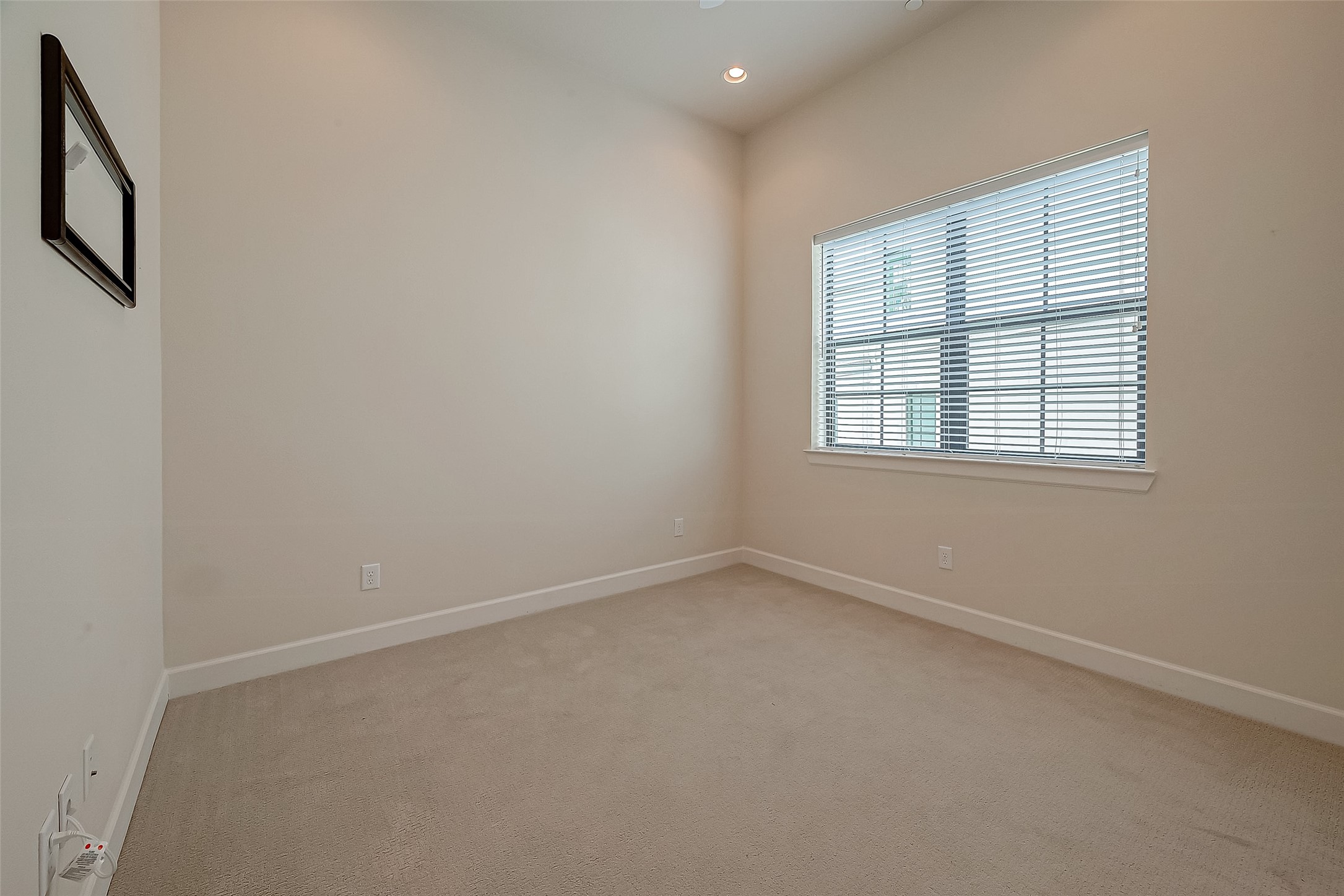 5305 Weslayan Street Houston, TX 77005 - Photo 29 of 50 an empty room with a window