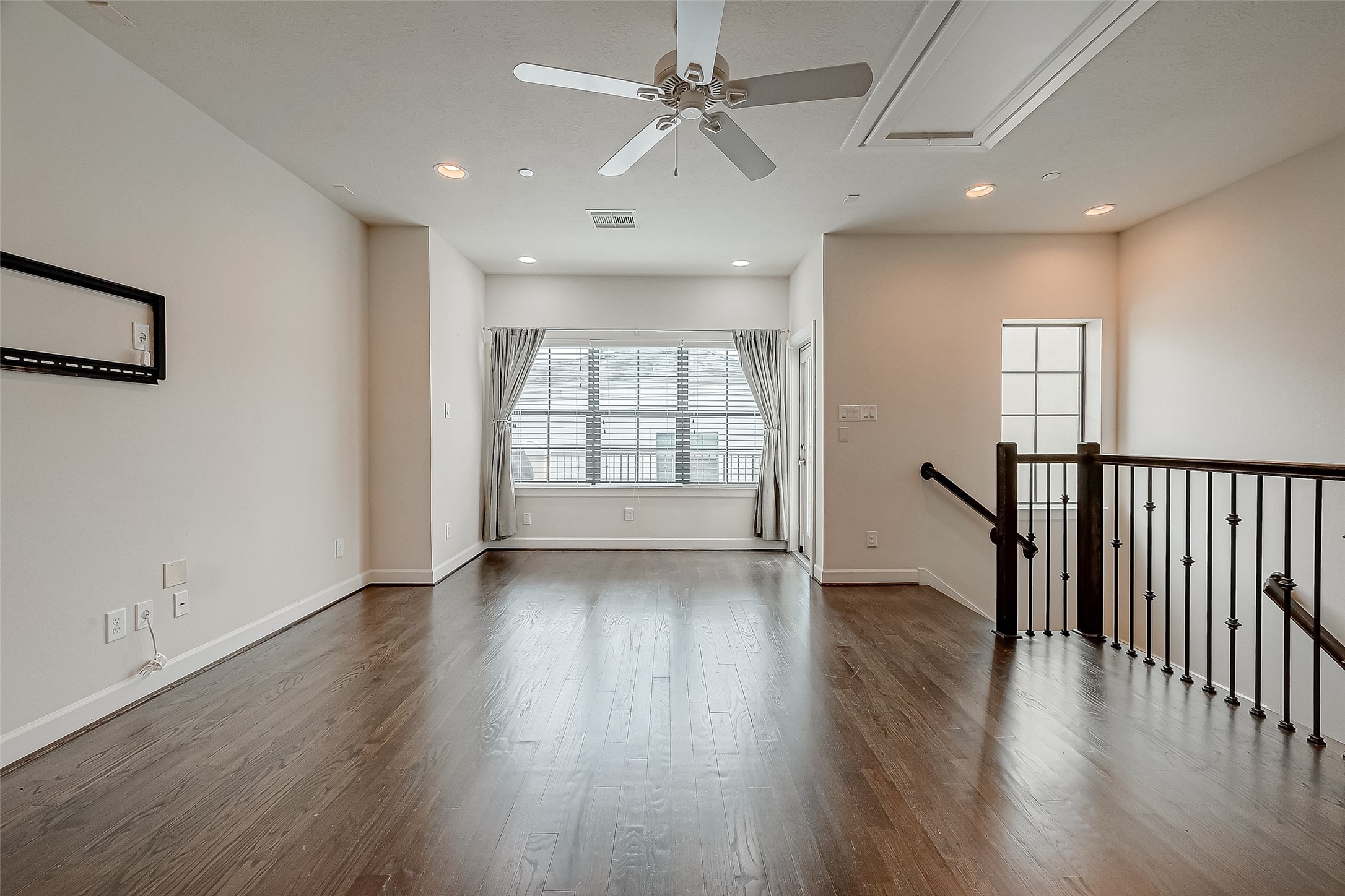 5305 Weslayan Street Houston, TX 77005 - Photo 34 of 50 wooden floor in an empty room with a window