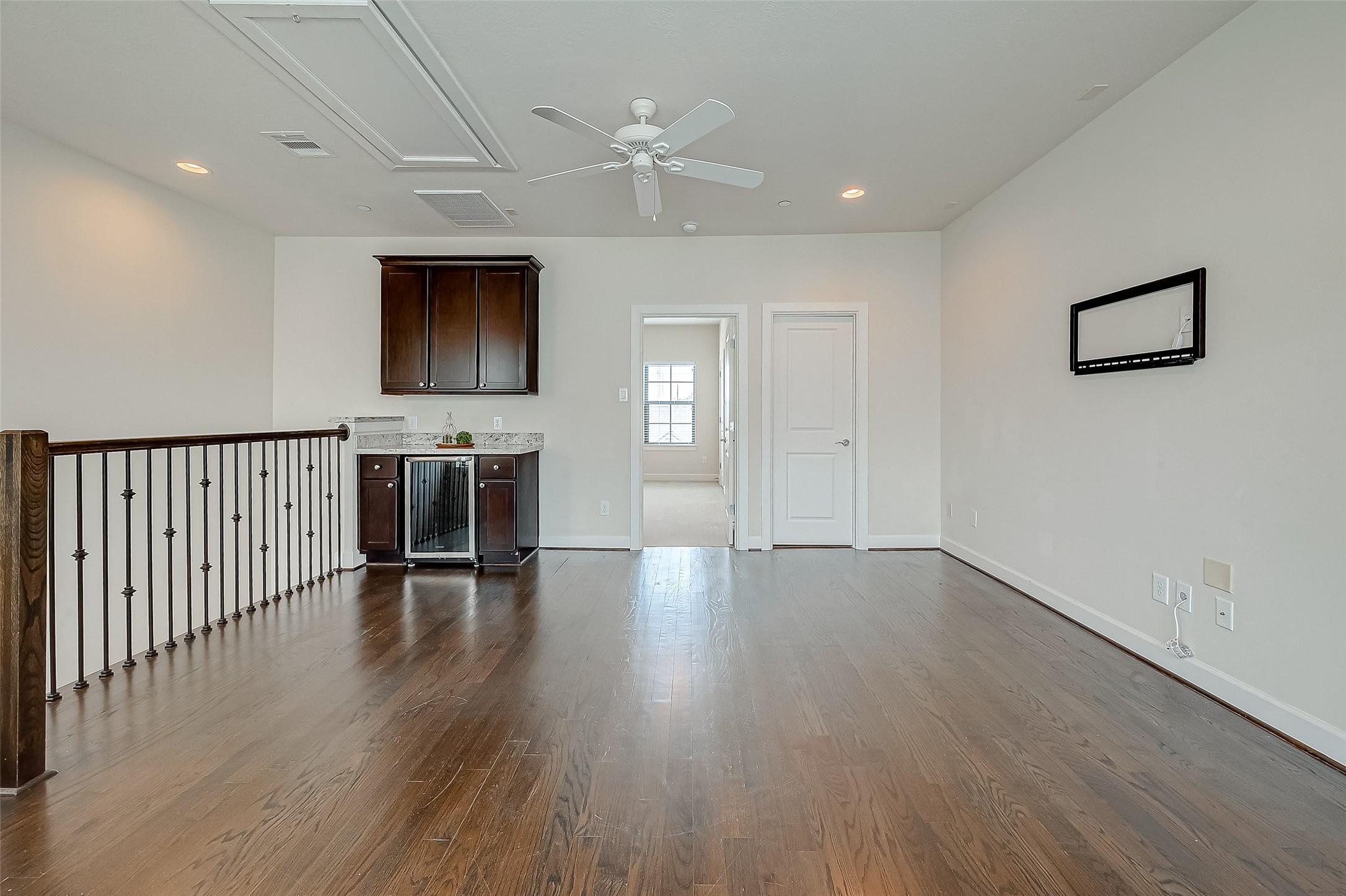 5305 Weslayan Street Houston, TX 77005 - Photo 35 of 50 an empty room with wooden floor and windows