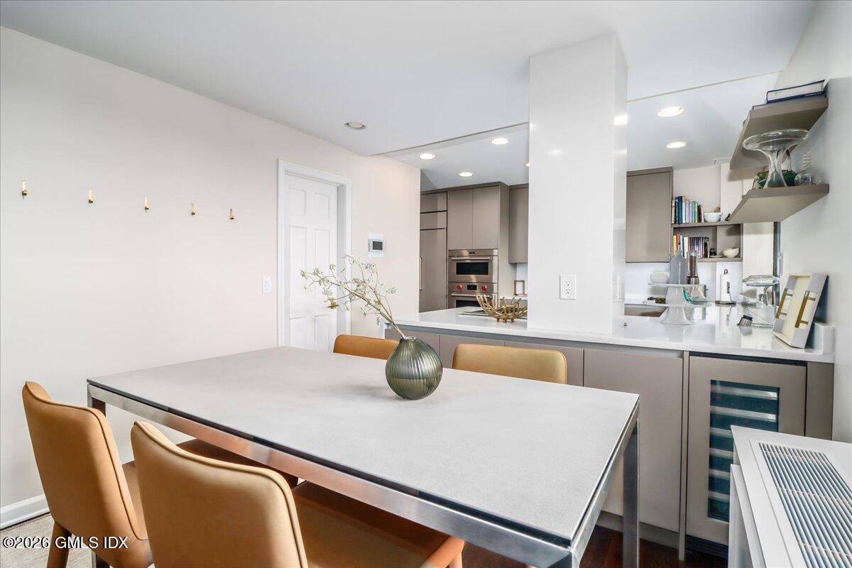 11 Lafayette Court, Unit 5B Greenwich, CT 06830 - Photo 9 of 34 Dual sided cabinetry has w/wine chiller