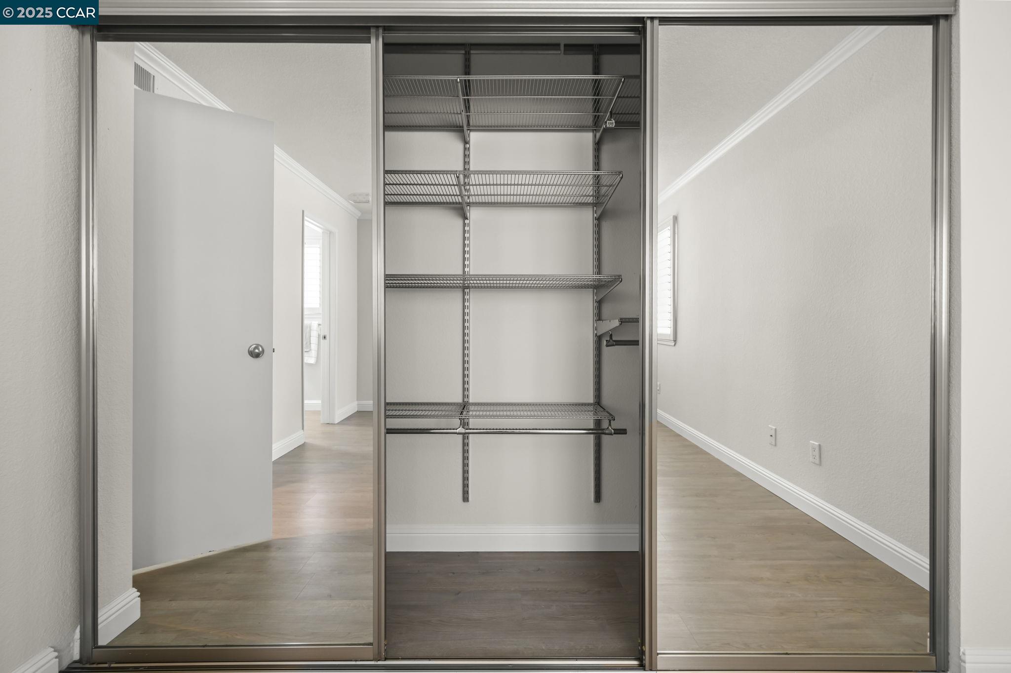 2550 Oak Road, Unit 209 Walnut Creek, CA 94597 - Photo 18 of 34 a view of walk in closet with empty racks