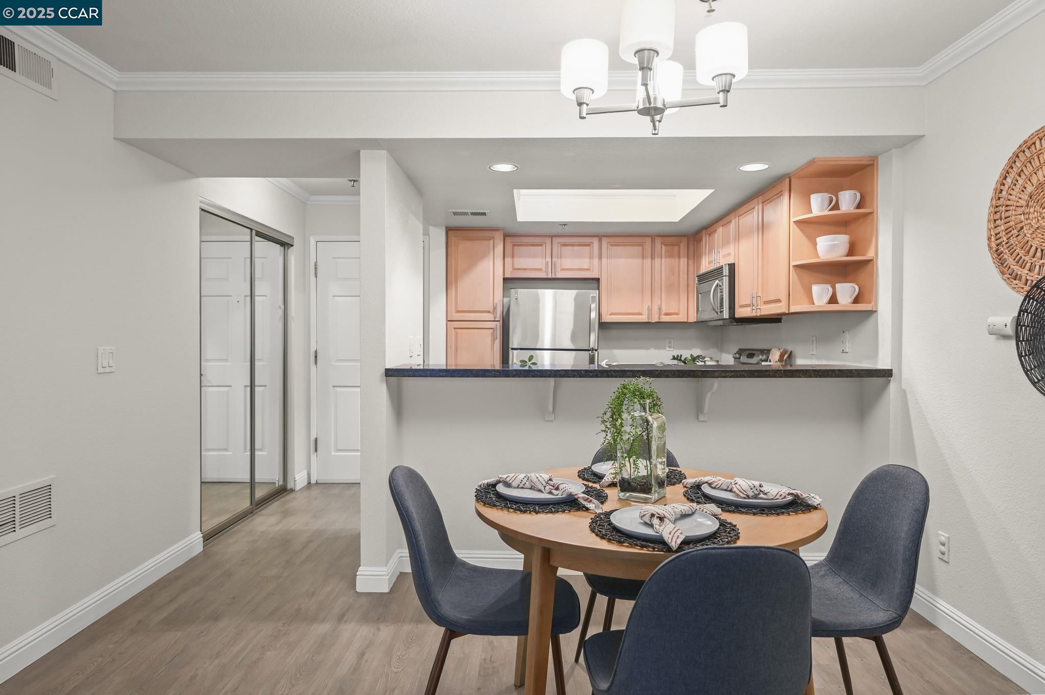 2550 Oak Road, Unit 209 Walnut Creek, CA 94597 - Photo 6 of 34 a view of a dining room with furniture and window