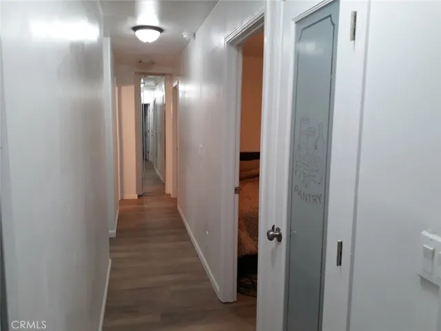 a view of a hallway with hallway and wooden floor